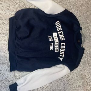 White and navy blue sweater